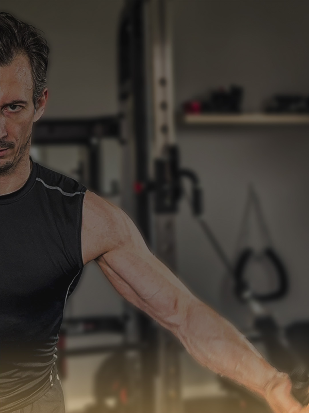 Christian Schönbauer training on the cable machine — controlled, focused, with reps in reserve
